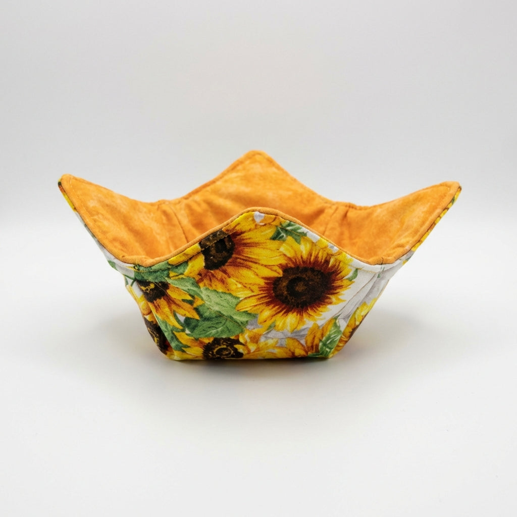 Fabric bowl with sunflower pattern on a white background