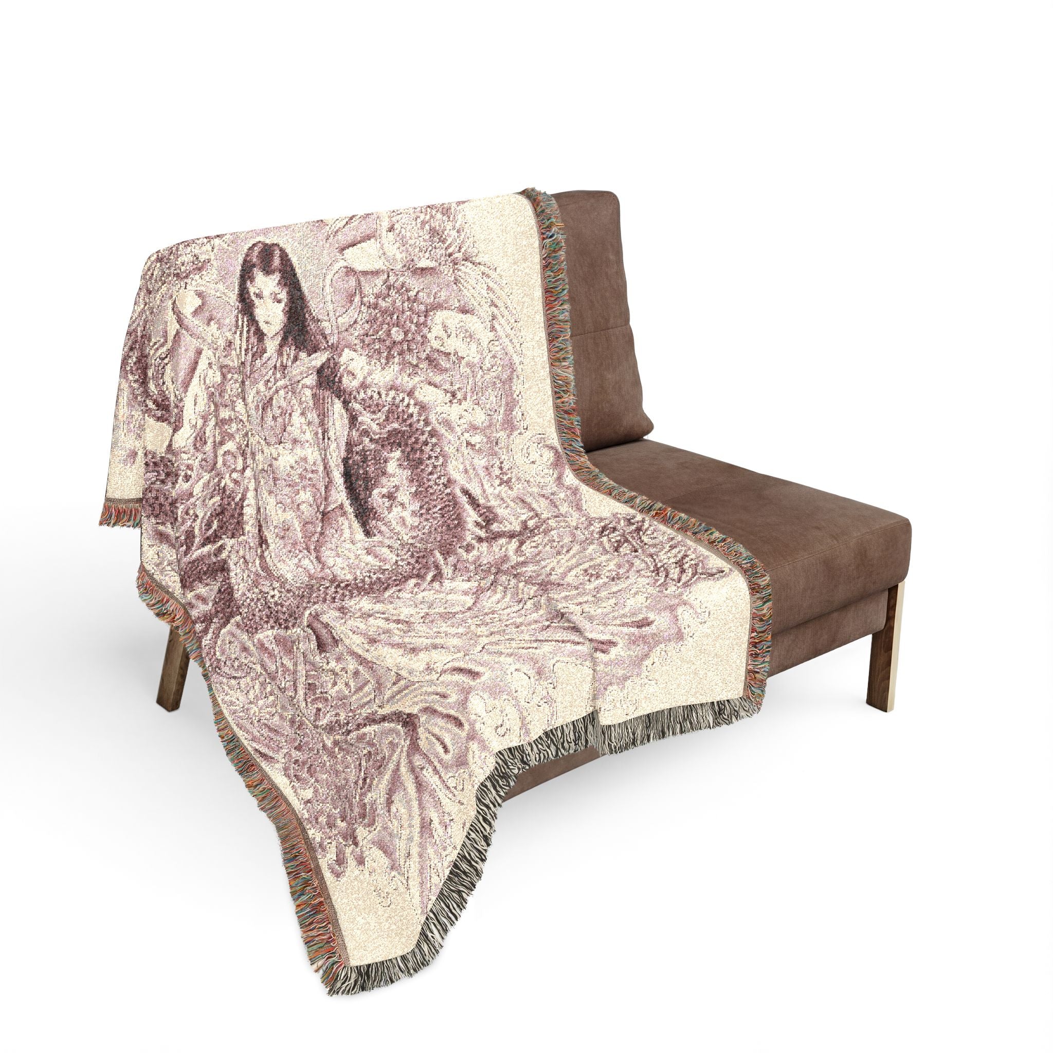 Decorative throw blanket with artistic design draped over a brown chair on a white background