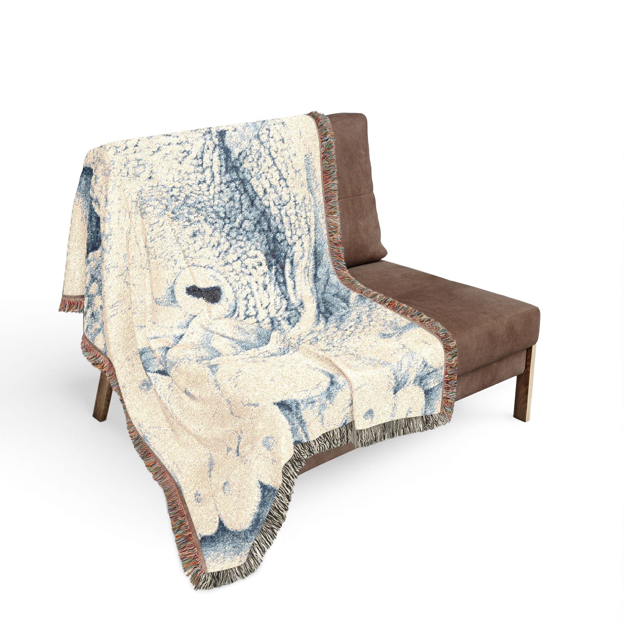 Decorative blanket with a wolf design draped over a brown chair on a white background